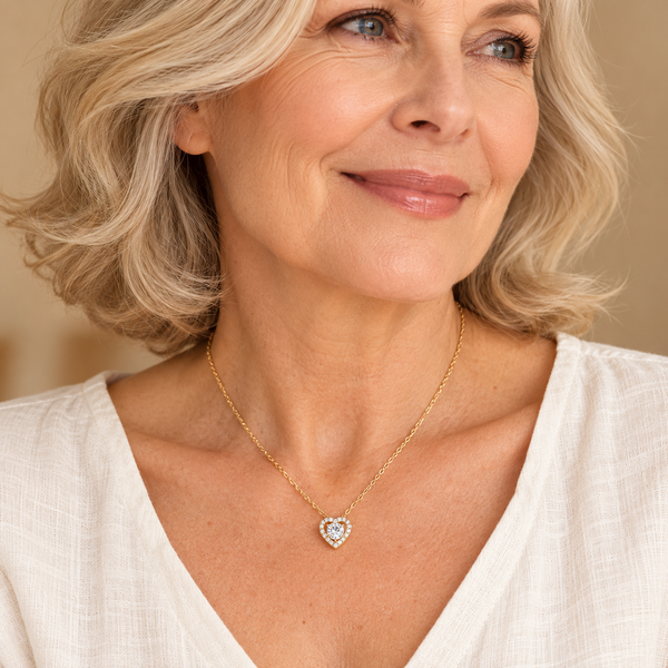 Gold heart pendant necklace on mature model