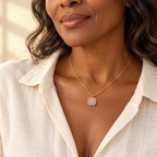 Gold clover pendant necklace on model