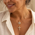 Gold cross and initial A necklace set on mature model