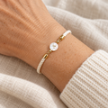 Ivory cord bracelet with pearl initial charm