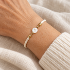 Ivory cord bracelet with pearl initial charm