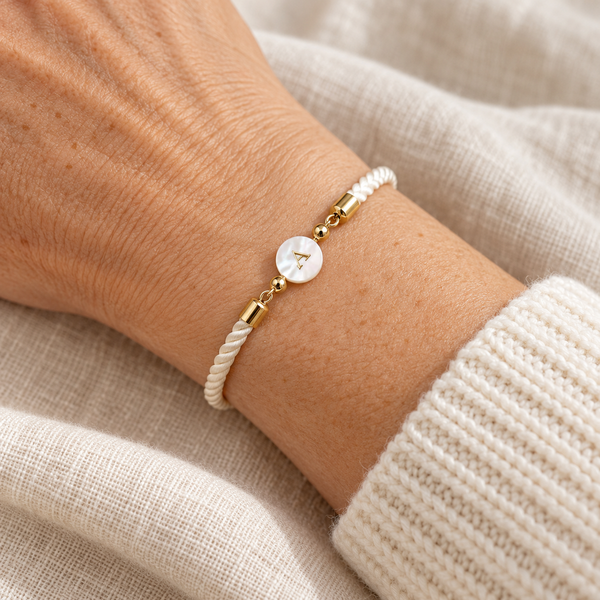 Ivory cord bracelet with pearl initial charm