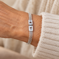 Silver D and B clasp bracelet on wrist