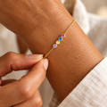 Four-colour birthstone chain bracelet on wrist