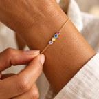 Four-colour birthstone chain bracelet on wrist