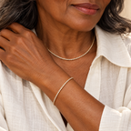 Delicate gold tennis necklace and bracelet set on model