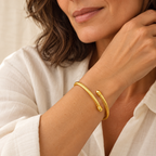 Twisted gold bangle on mature model