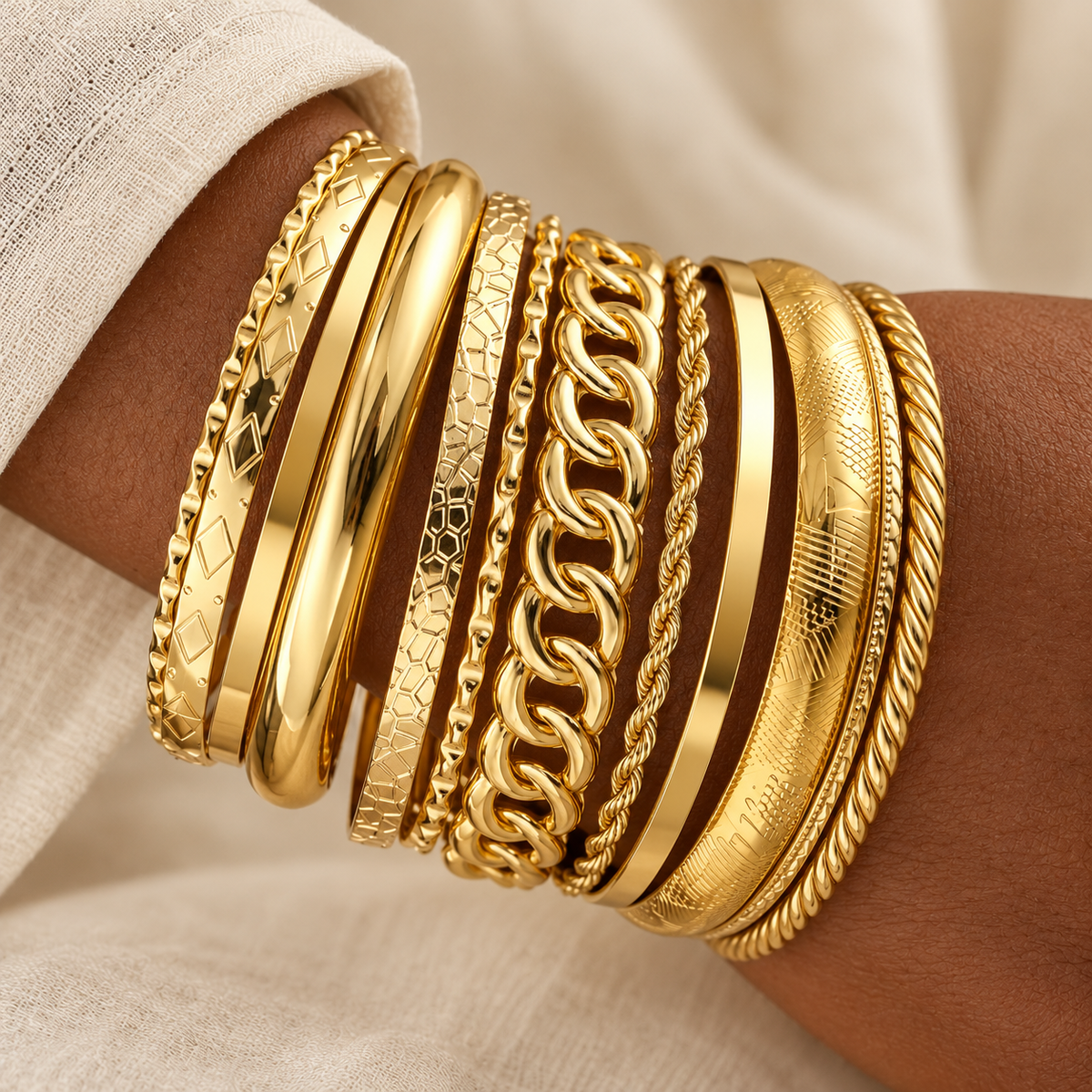Ten-piece mixed gold bracelet stack on model