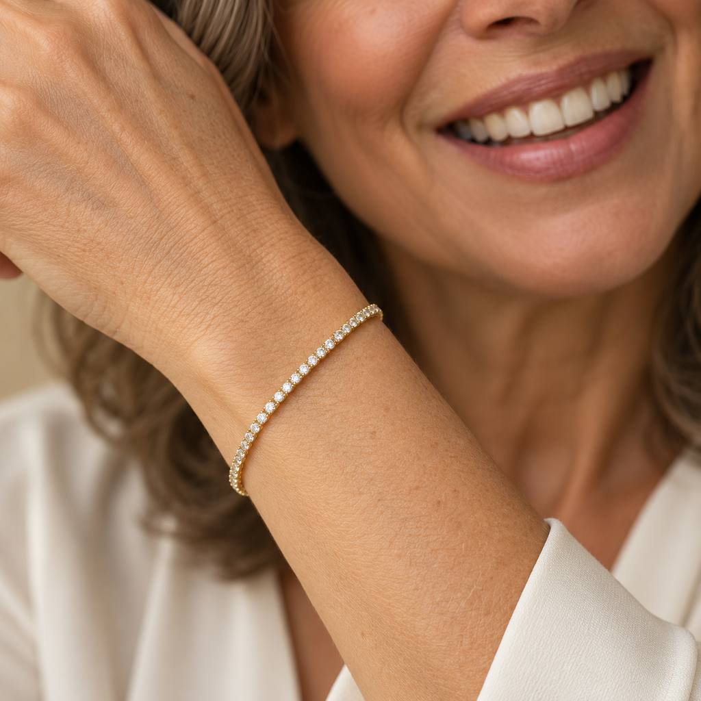 Fine gold tennis bracelet on model