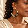 Evelise Jewellery leopard accent hoop earrings on a woman