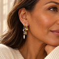 Evelise triple huggie dangle earrings on a woman