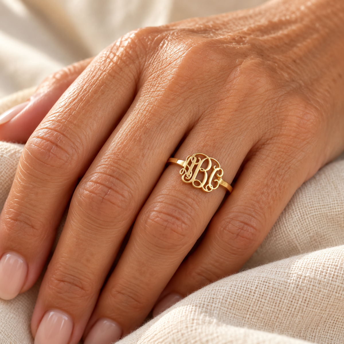 Evelise monogram ring on a hand