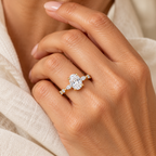 Evelise oval moissanite accented band ring on a hand