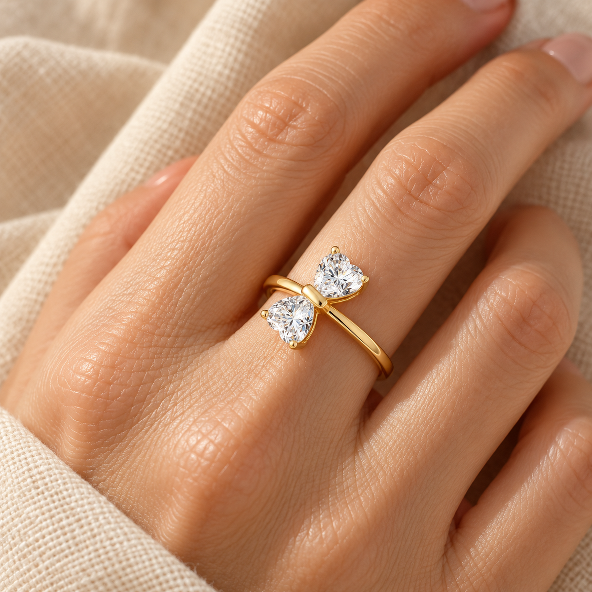 Evelise moissanite feminine bow ring on a hand