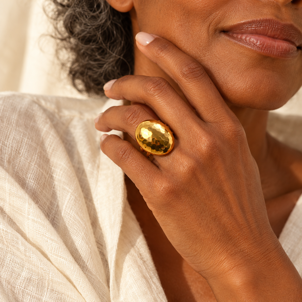 Evelise hammered oval dual band ring on a hand