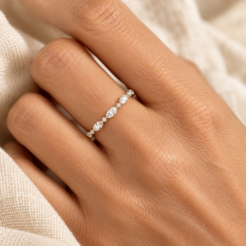 Evelise dainty oval diamond ring on a hand
