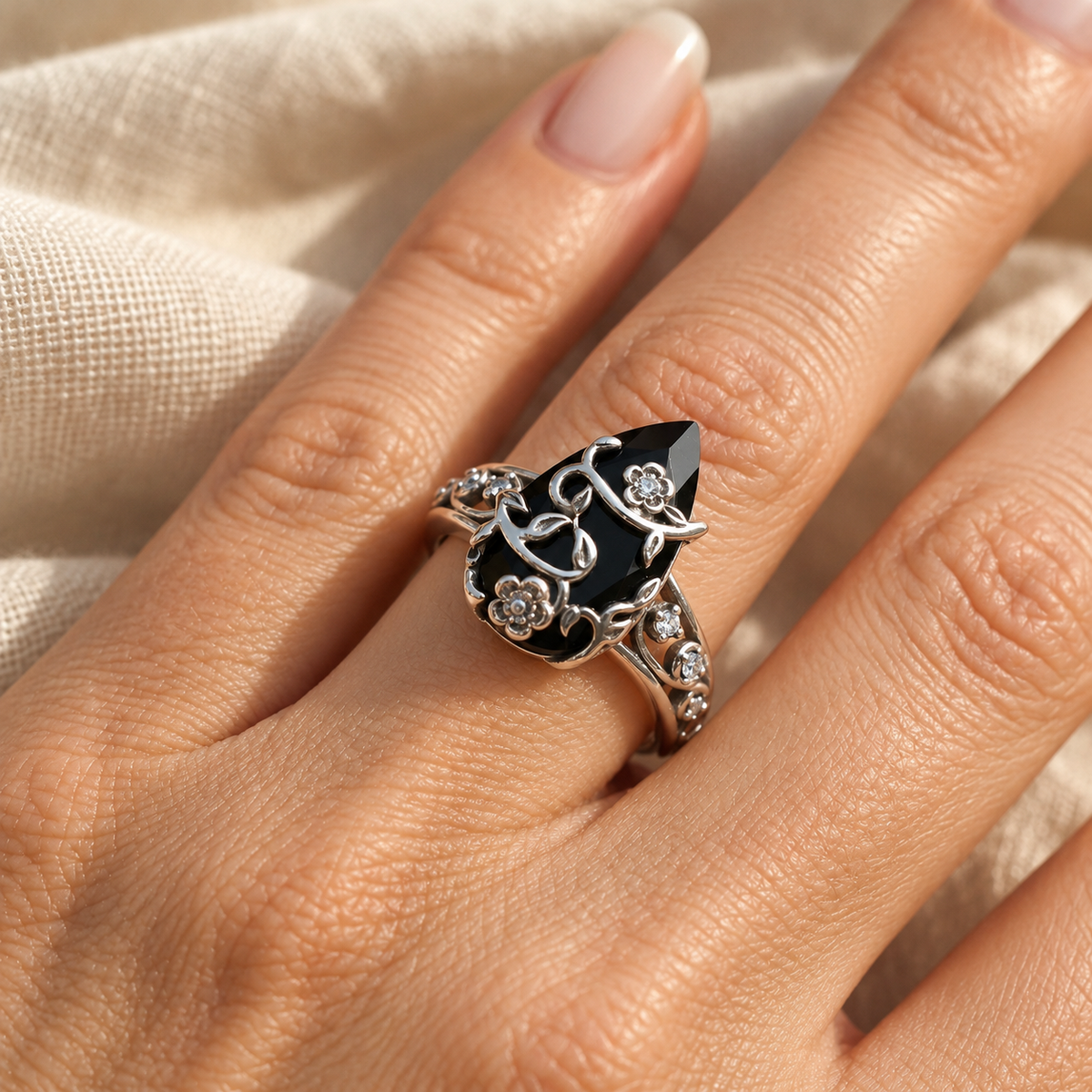Evelise floral onyx ring on a hand