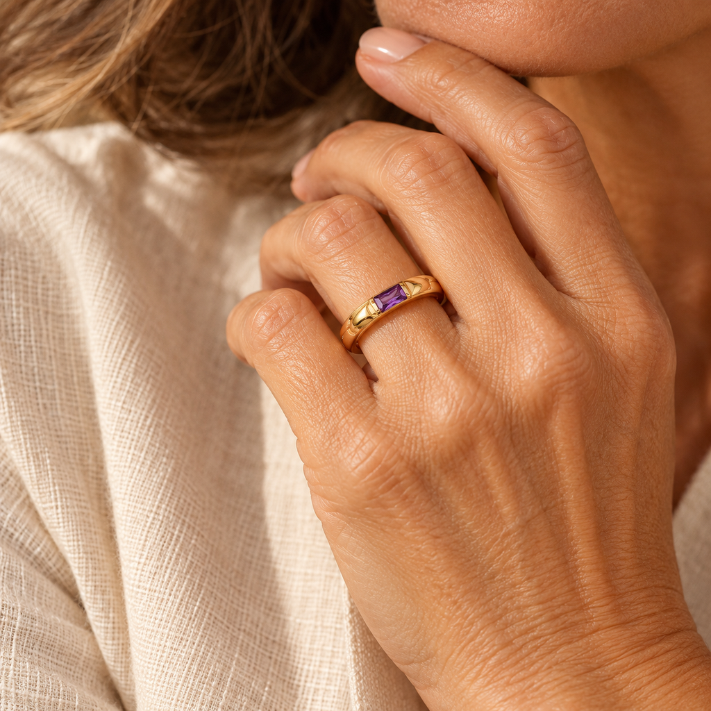 Evelise baguette birthstone ring on a hand