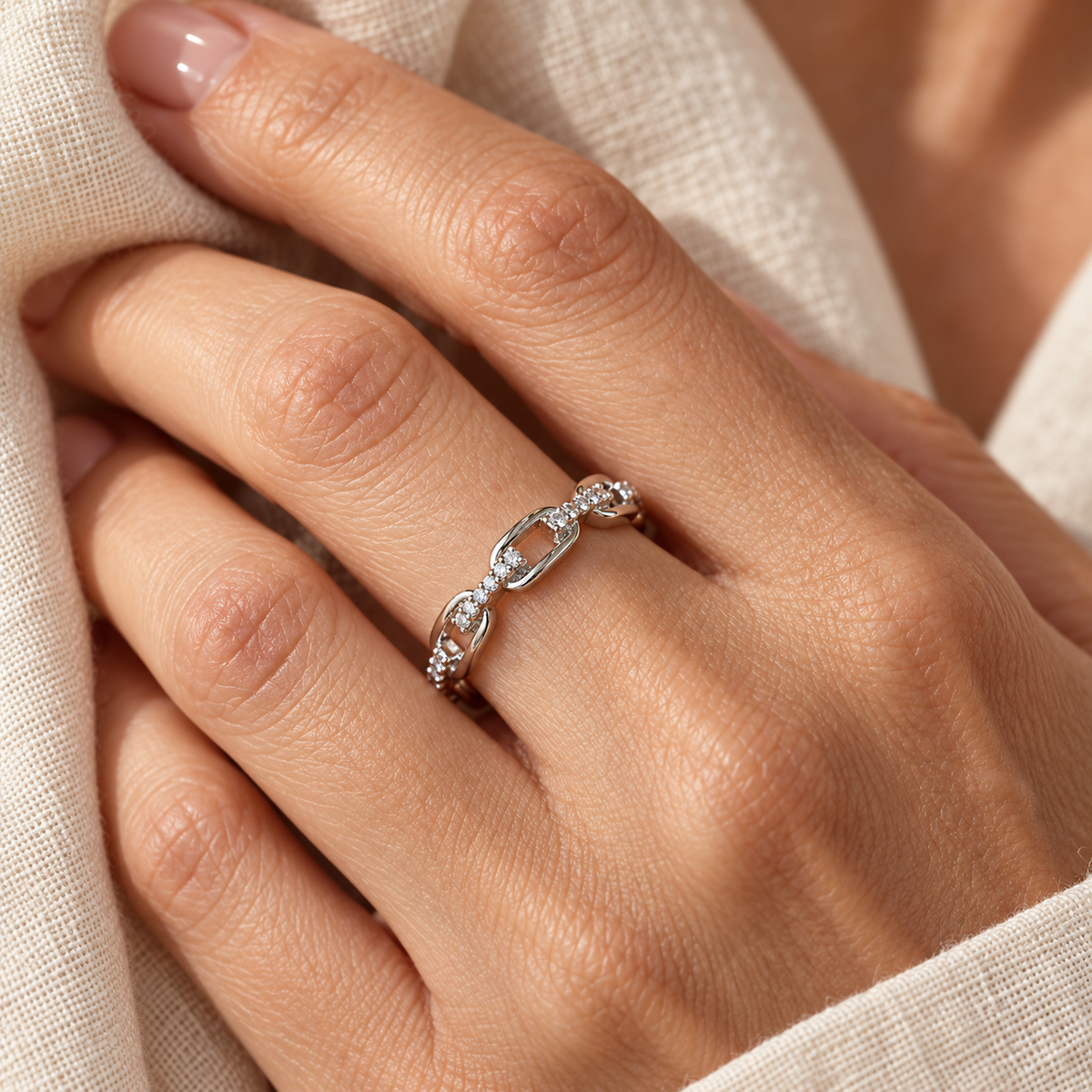 Evelise zircon accented chain ring on a hand