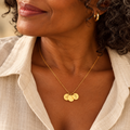Evelise personalised disc initial necklace on a woman