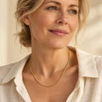 Gold rope necklace on mature woman