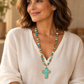 Turquoise cross necklace with mixed beads on a woman